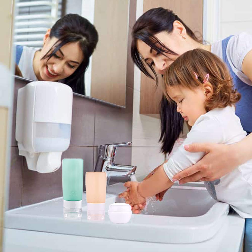 A child washes their hands at a sink with adult guidance, surrounded by skincare products on the counter.